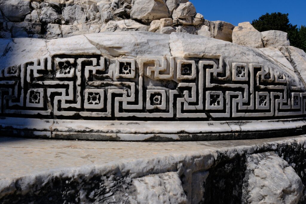 Ancient,Greek,Meander,And,Swastika,Pattern,Carved,On,Marble,Column